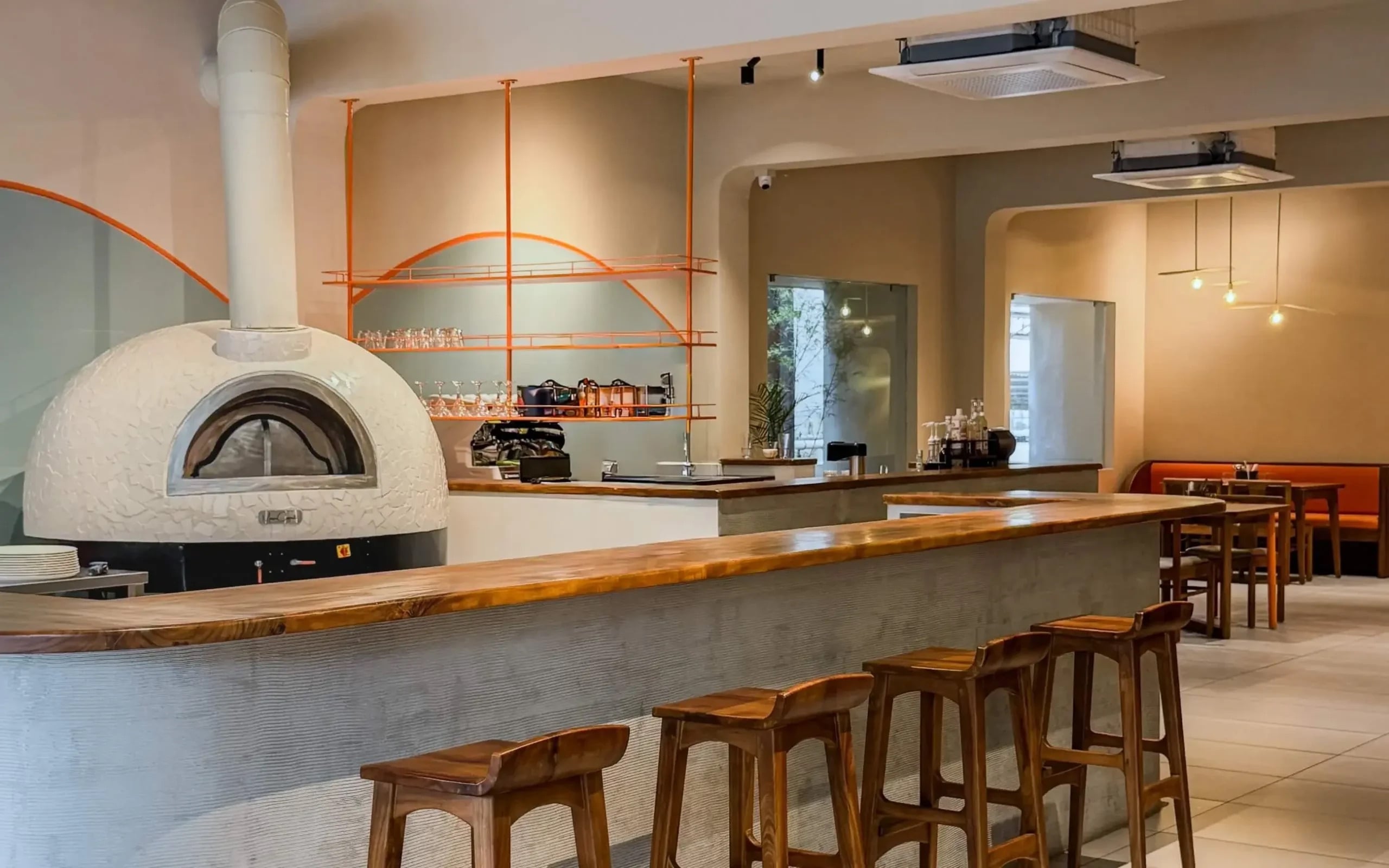 the atmosphere created by a wood fired pizza oven